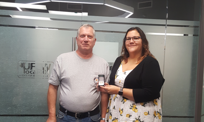 Carl(L) gets his retirement ring from Union Rep Char