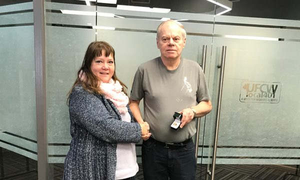 Brian receives his 401 retirement ring from his Union Rep Cheryl