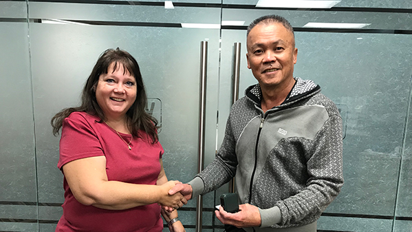 Vincent Tang is presented with his 401 retirement ring by his Union Rep Cheryl