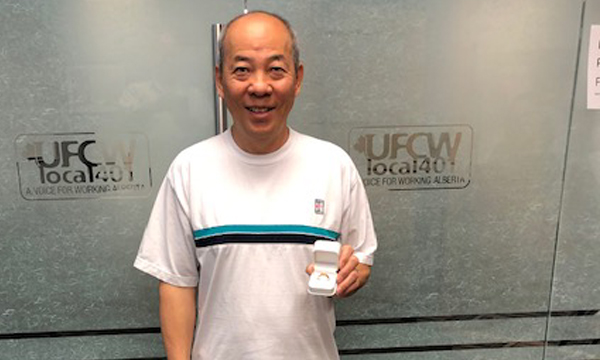 Tony shows off his new gold 401 retirement ring