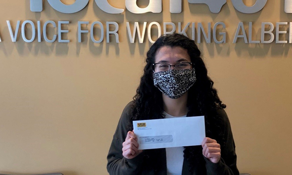 Ana picks up her scholarship cheque at the union office