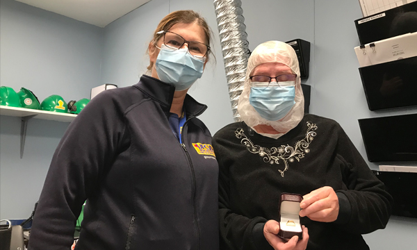 Gail (on right) receives her UFCW 401 gold retirement ring
