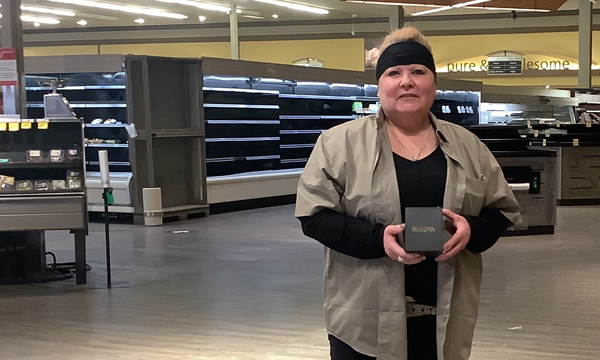 Judith took a break from setting up the new FreshCo store to receive her UFCW 401 retirement gift from her Walking Steward