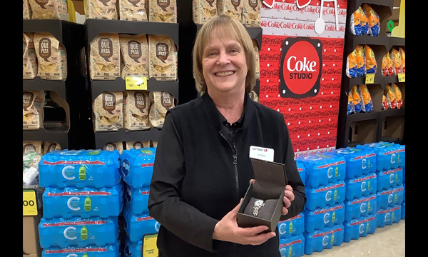 Kathy gets a visit from her union rep with her UFCW retirement gift