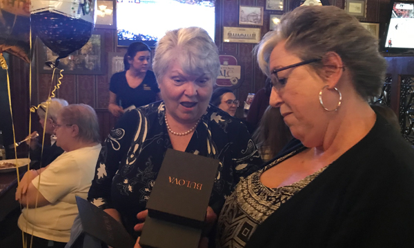 Maureen (L) is presented with her retirement gift by Shop Steward Ernie