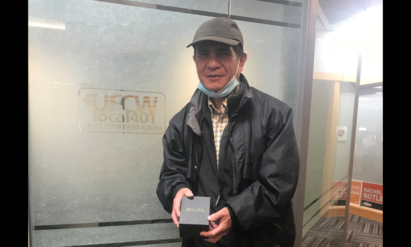 Sidney pops into the union office to pick up his UFCW retirement gift
