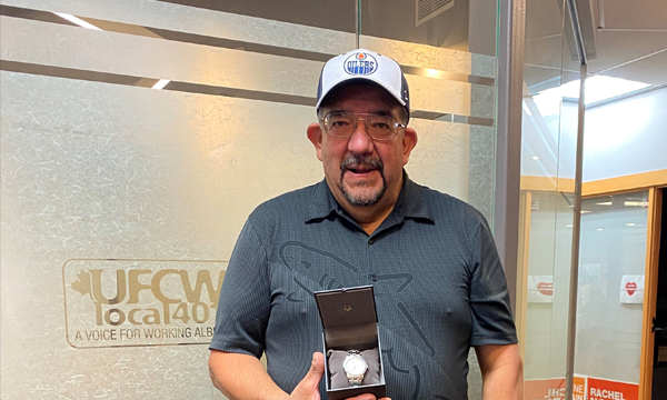 John pops into the union office to pick up his retirement gift