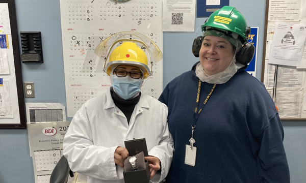Eden receives her retirement gift from her Union Shop Steward Amanda
