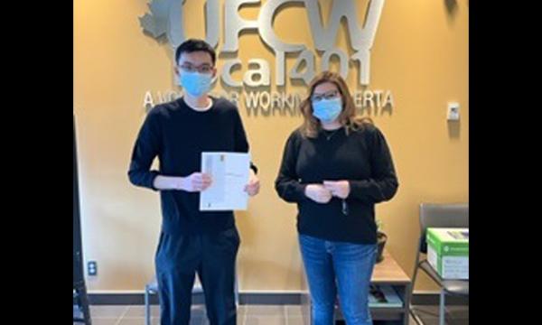 Justin visits the union office to pick up his scholarship cheque