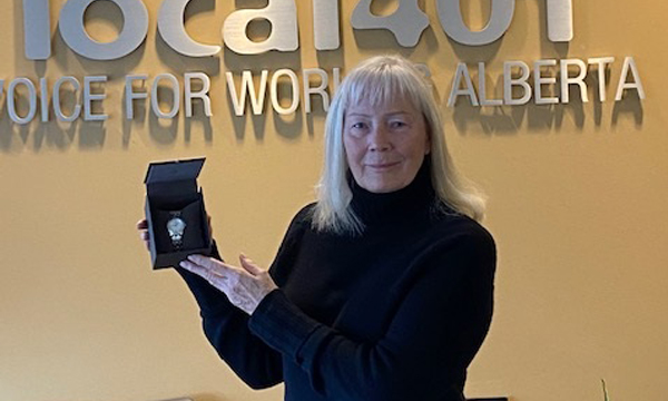 Sandra drops by the union office to collect her retirement gift