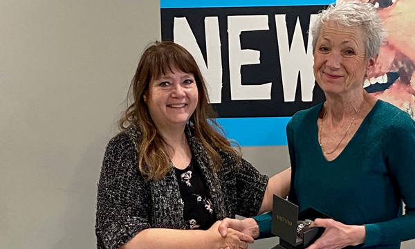 Judi pops into the union office to pick up her retirement watch from her union rep Cheryl