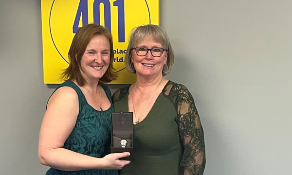 Janice receives her retirement watch from her Walking Steward Cat