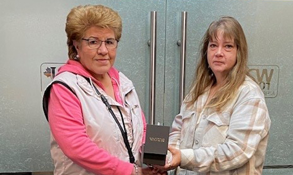 Gladys receives her retirement gift from her Union Rep Cheryl