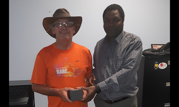 Gord (L) is given his retirement watch from his Walking Steward Joseph