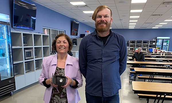Maria receives her retirement watch from her union rep Jeff